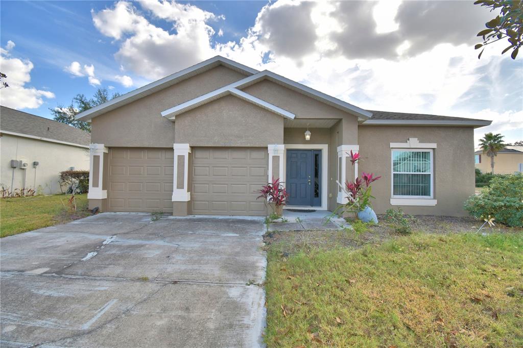5610 Forest Ridge Drive Winter Haven, FL 33881 - Photo 3 of 70 a view of a house with backyard and garden