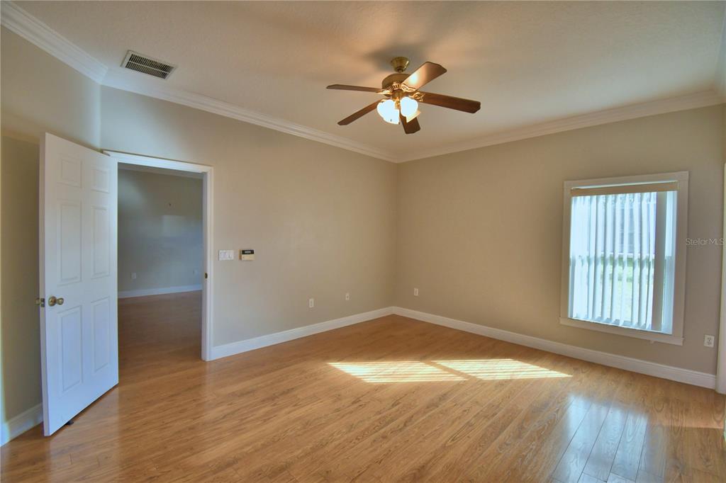 5610 Forest Ridge Drive Winter Haven, FL 33881 - Photo 39 of 70 wooden floor in an empty room with a window