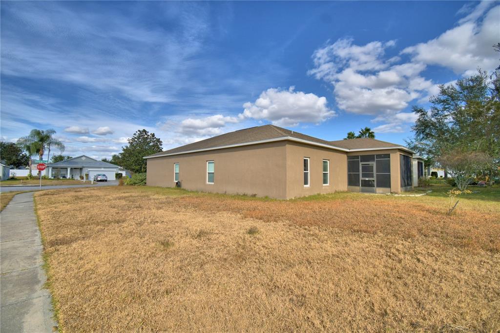 5610 Forest Ridge Drive Winter Haven, FL 33881 - Photo 4 of 70 a front view of house with yard and trees