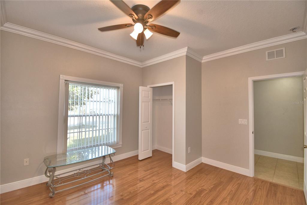 5610 Forest Ridge Drive Winter Haven, FL 33881 - Photo 47 of 70 wooden floor in an empty room with a window