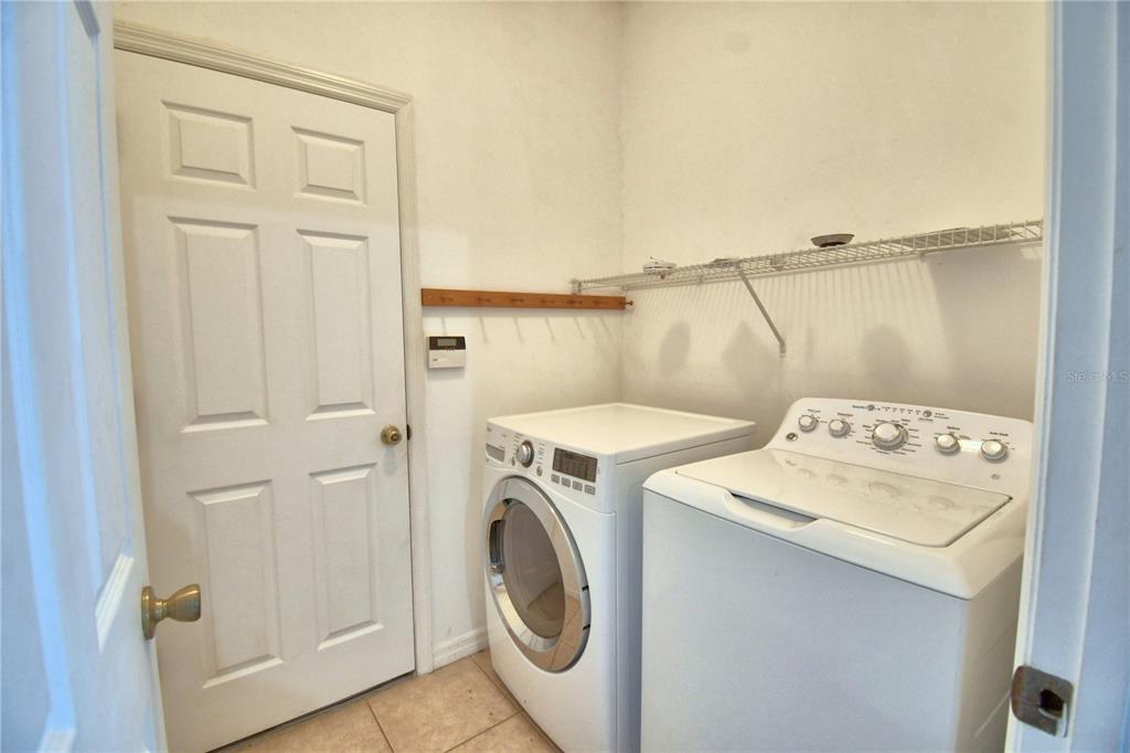 5610 Forest Ridge Drive Winter Haven, FL 33881 - Photo 48 of 70 a utility room with dryer and washer