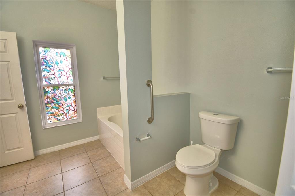5610 Forest Ridge Drive Winter Haven, FL 33881 - Photo 65 of 70 a bathroom with a toilet and a shower