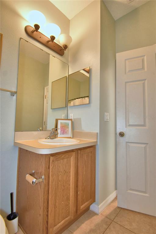 5610 Forest Ridge Drive Winter Haven, FL 33881 - Photo 67 of 70 a bathroom with a sink and a mirror