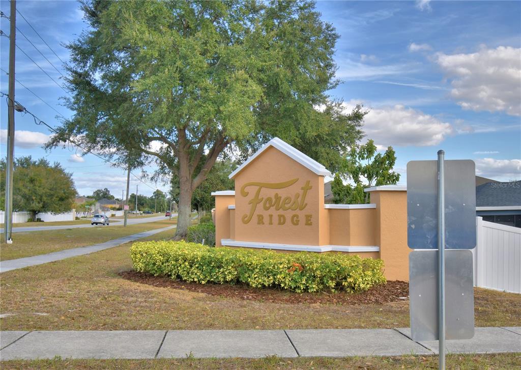 5610 Forest Ridge Drive Winter Haven, FL 33881 - Photo 70 of 70 a front view of a house with garden
