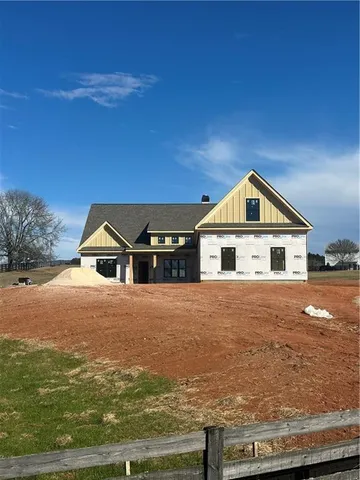 a front view of a house with yard