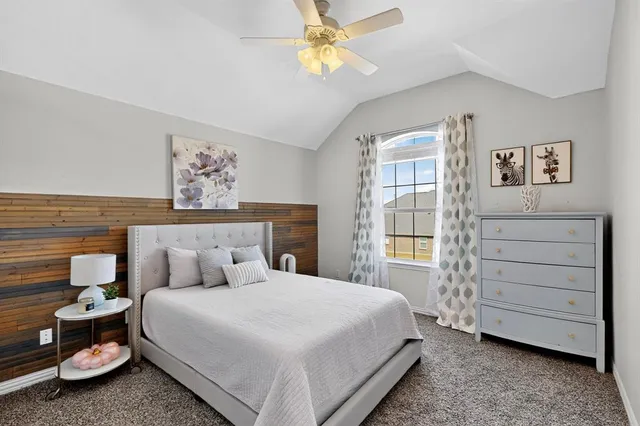 a bathroom with a tub a sink and a window