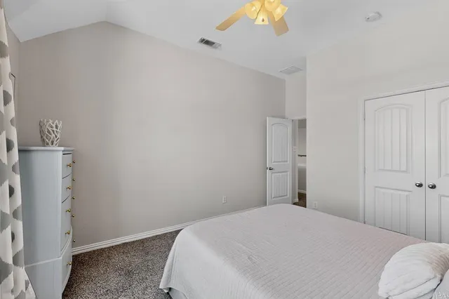 a bathroom with a double vanity sink a mirror and a shower