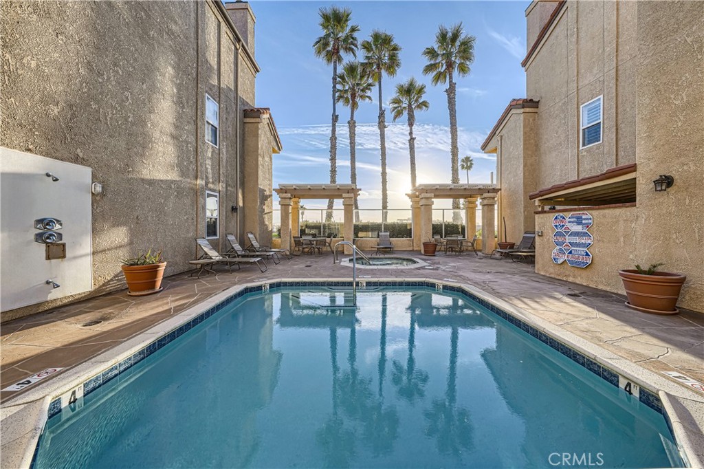 2000 Highway 1, Unit 309 Huntington Beach, CA 92648 - Photo 11 of 33 a view of a swimming pool with a patio