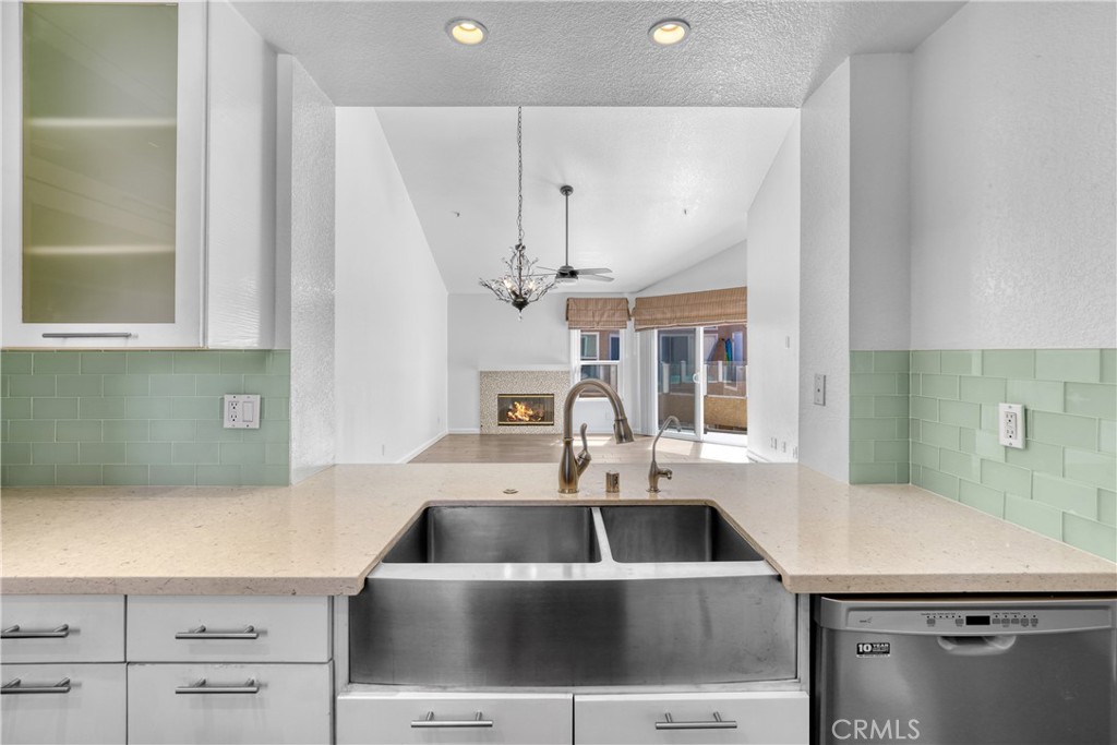 2000 Highway 1, Unit 309 Huntington Beach, CA 92648 - Photo 20 of 33 a kitchen with a sink a counter space and windows
