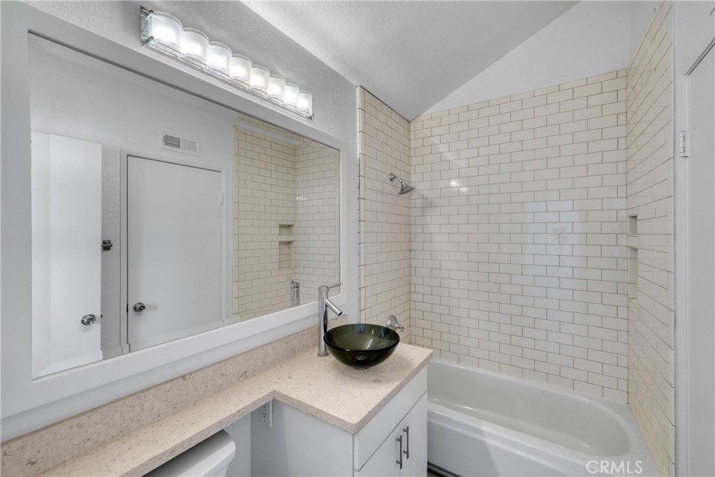 2000 Highway 1, Unit 309 Huntington Beach, CA 92648 - Photo 27 of 33 a bathroom with a bathtub and a shower