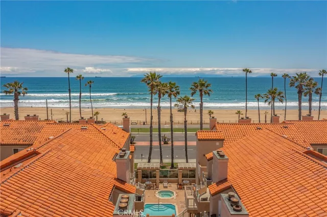 a view of a balcony with floor to ceiling windows with wooden floor