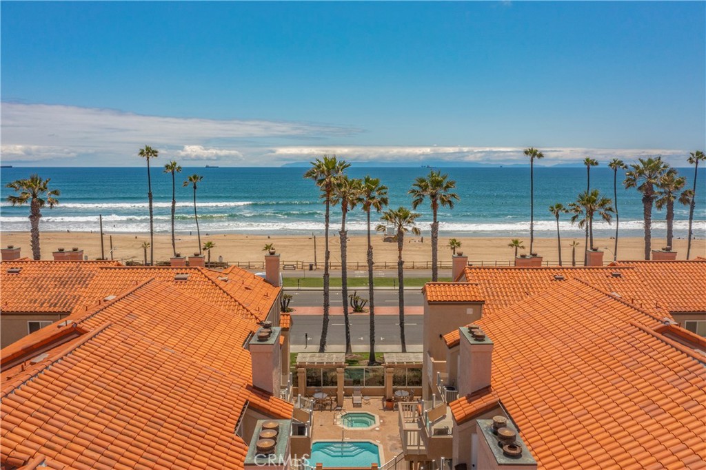 2000 Highway 1, Unit 309 Huntington Beach, CA 92648 - Photo 10 of 33 a view of a balcony with floor to ceiling windows with wooden floor