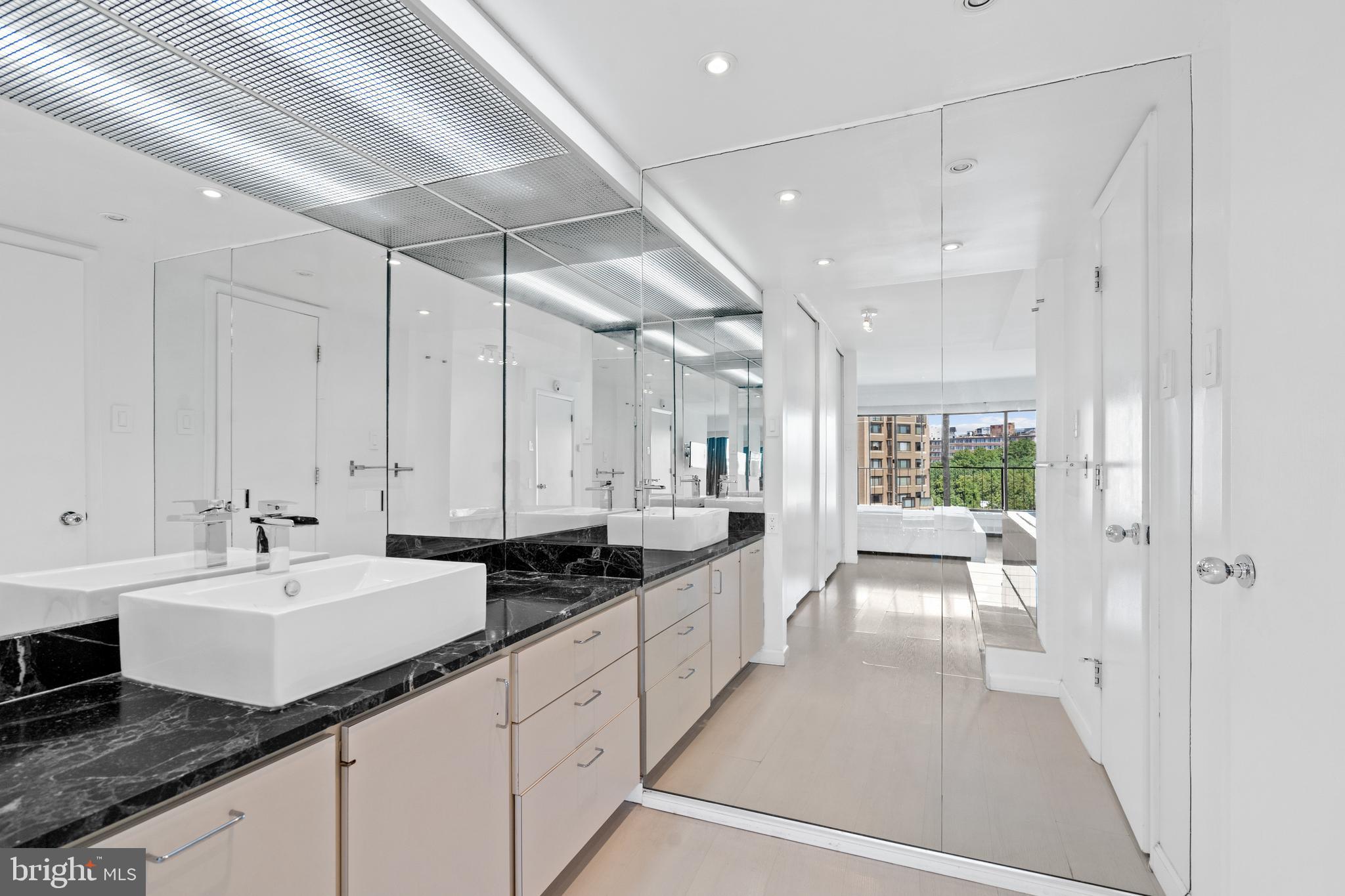 2510 Virginia Avenue Northwest, Unit 708N Washington, DC 20037 - Photo 19 of 37 a large white kitchen with a large window