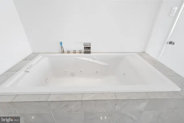 a view of a bathtub in a bathroom