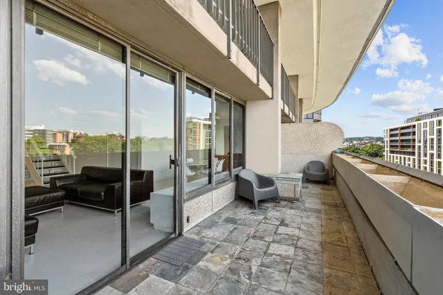 an outdoor sitting area with furniture