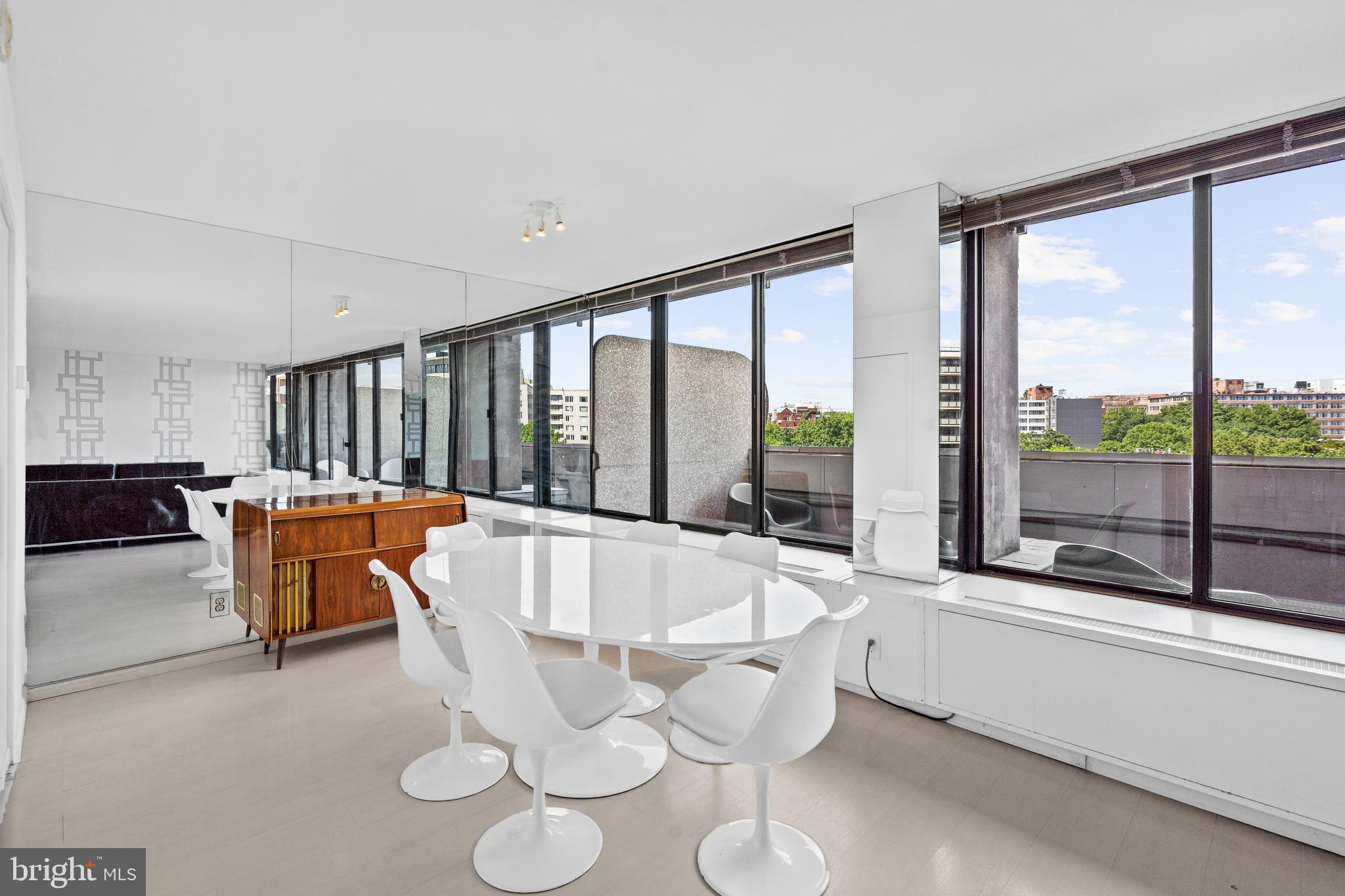 2510 Virginia Avenue Northwest, Unit 708N Washington, DC 20037 - Photo 6 of 37 a living room with furniture and a large window