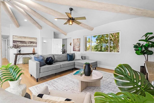 a view of a kitchen area with granite countertop a potted plant