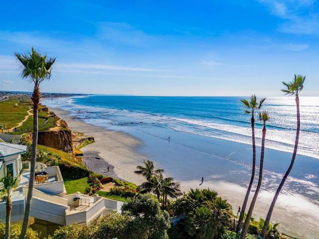 a bedroom with a bed and a mirror