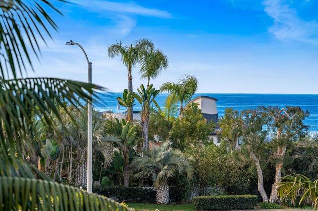 a bedroom with a bed a table and chair