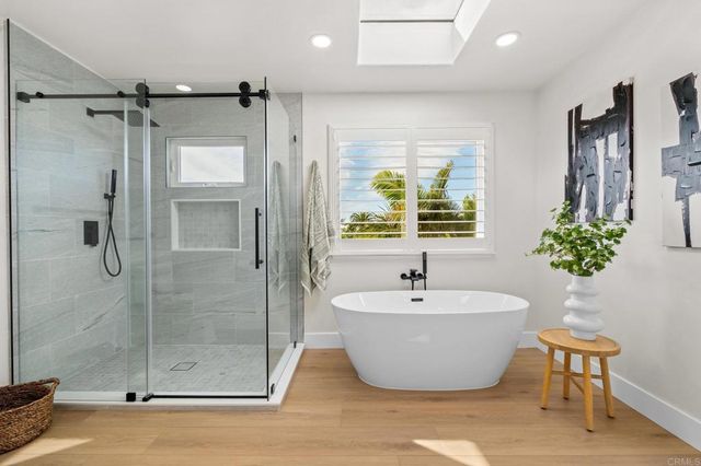 a view of a patio with table and chairs and potted plants