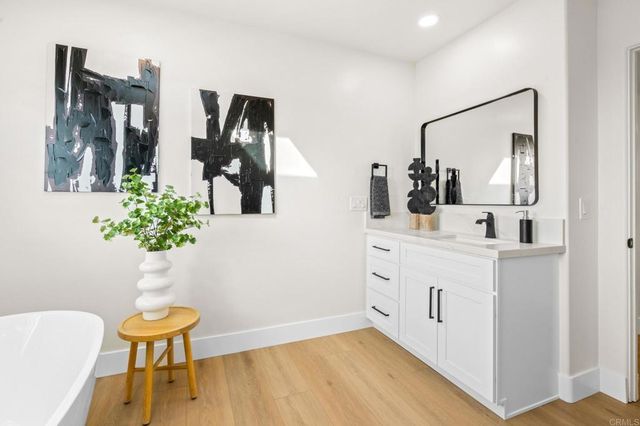 a view of a chairs and table in a backyard