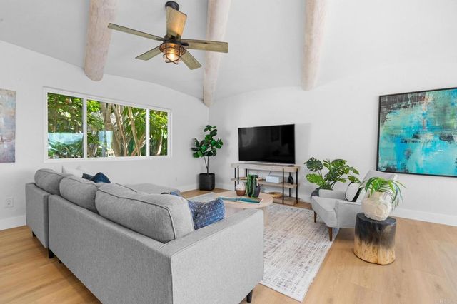 a view of a livingroom with furniture and rug