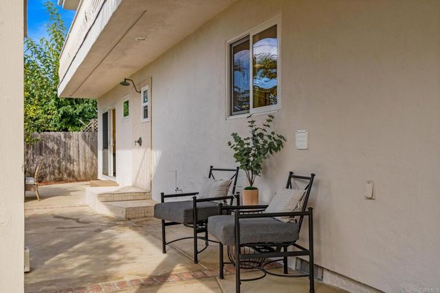 a view of living room with furniture and flower pot