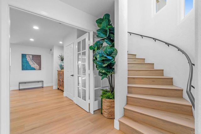 a kitchen with stainless steel appliances granite countertop a stove and a sink