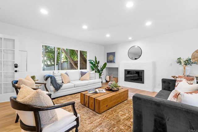 a bedroom with bed and a window