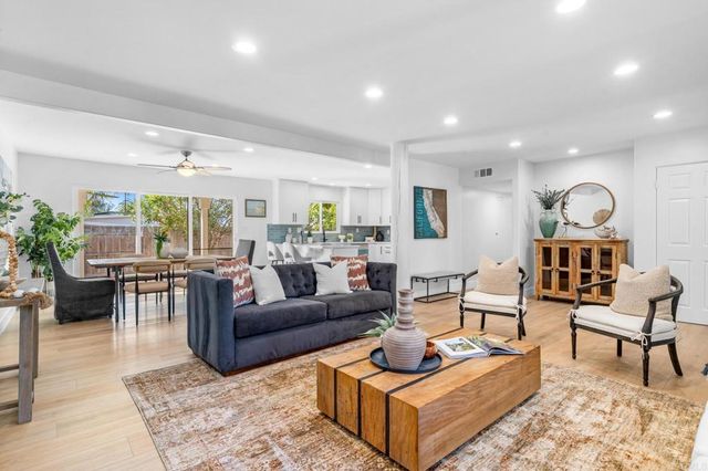 a bathroom with a shower sink vanity granite and shower
