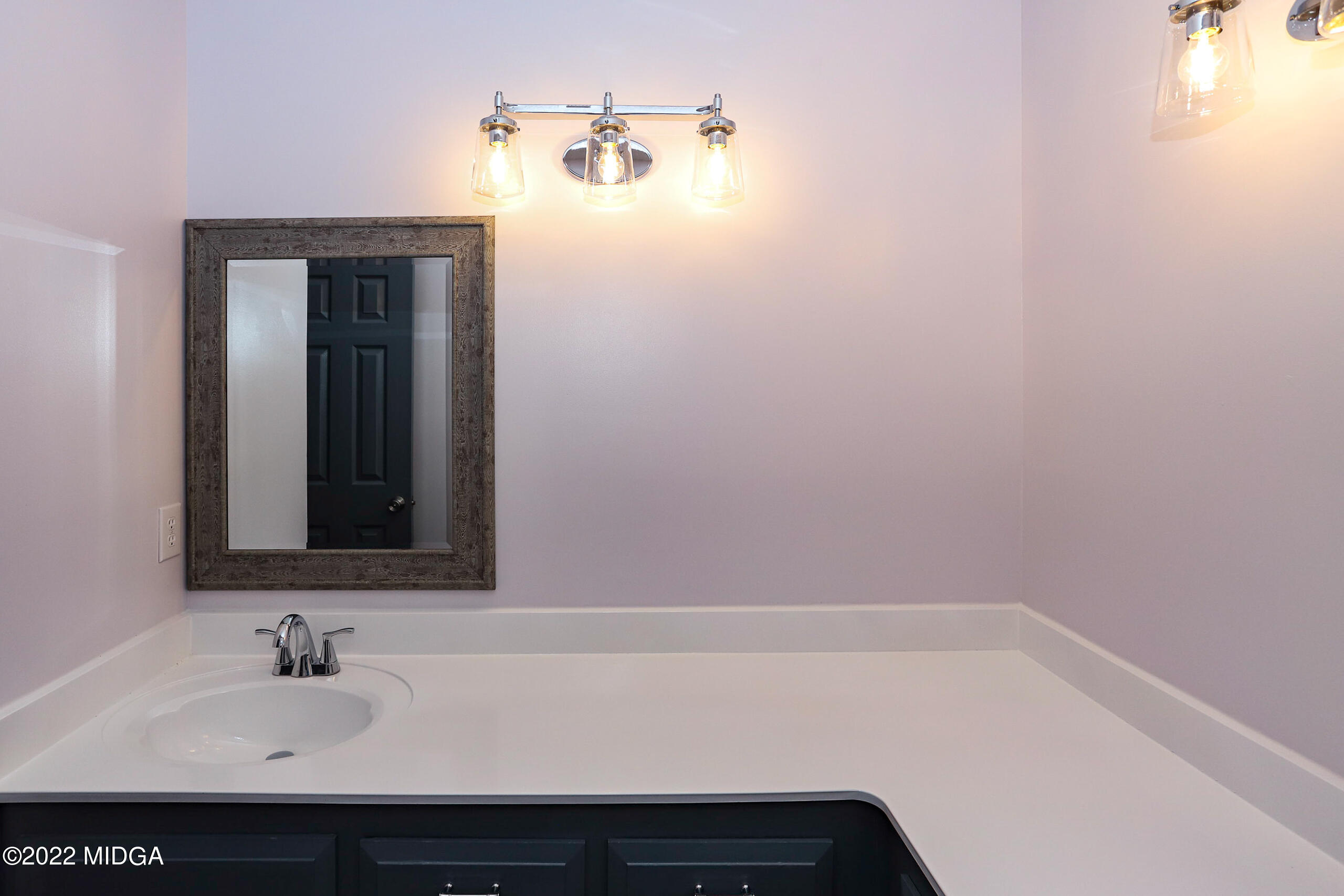 107 Ridge Circle Macon, GA 31216 - Photo 25 of 80 a bathroom with a sink and a mirror