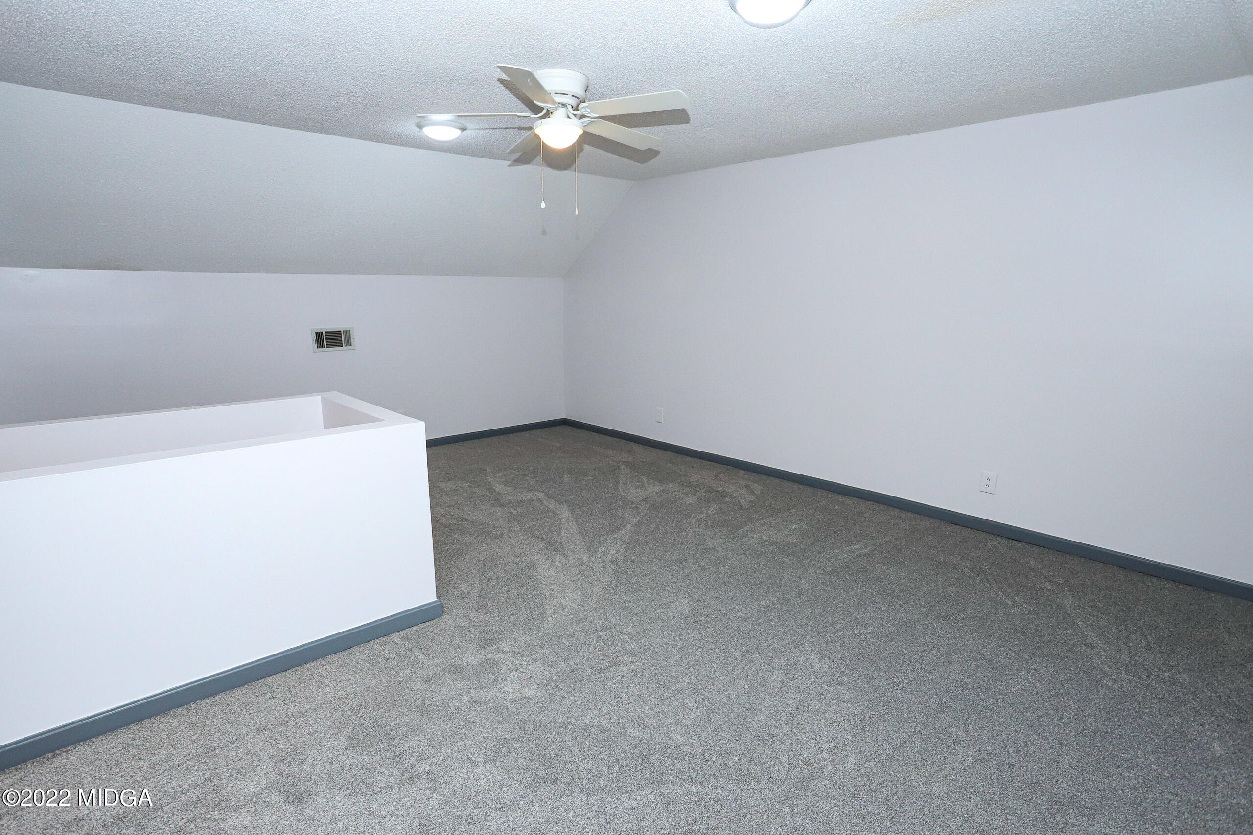 107 Ridge Circle Macon, GA 31216 - Photo 43 of 80 an empty room with a ceiling fan and a window