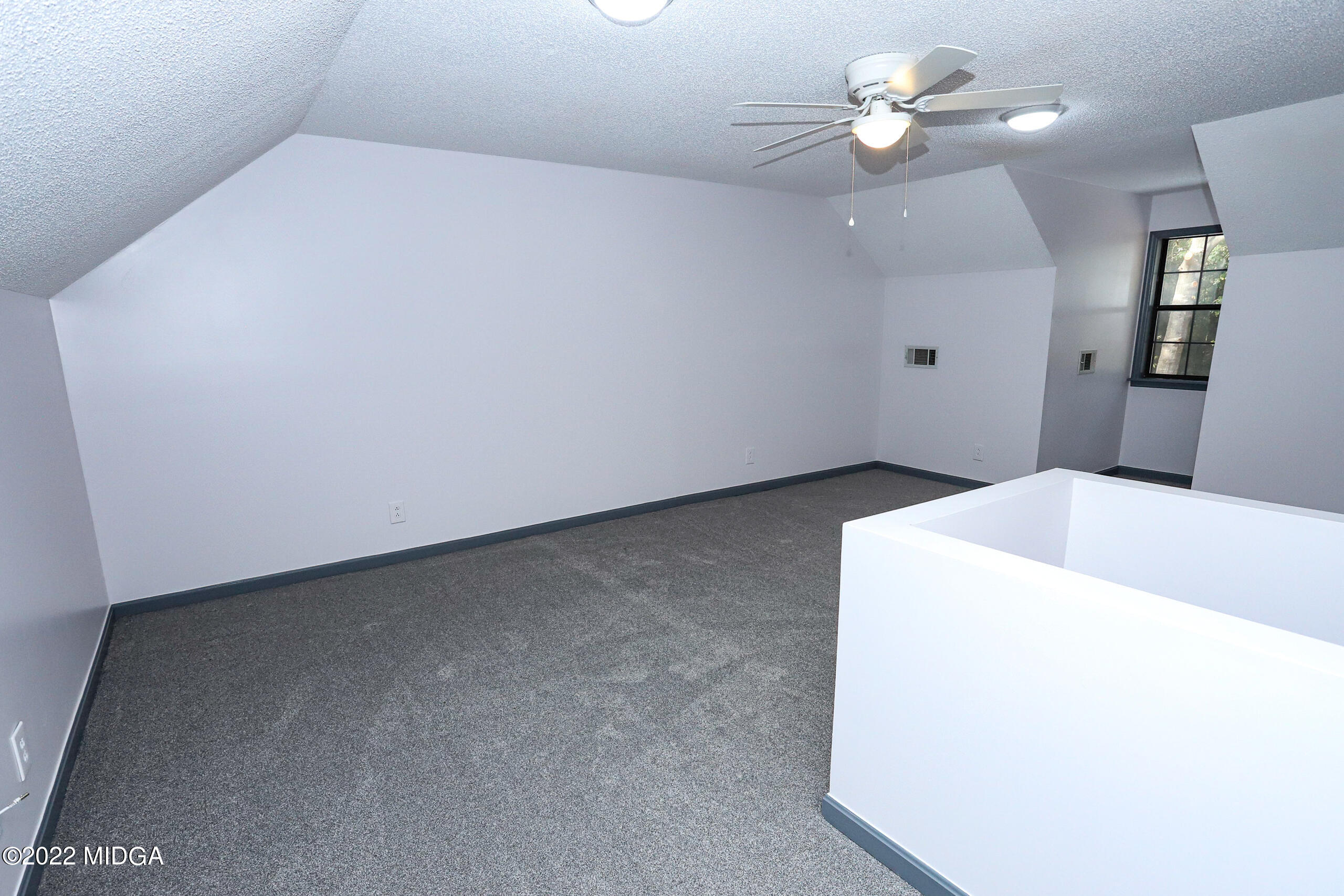 107 Ridge Circle Macon, GA 31216 - Photo 44 of 80 a view of a big room with chandelier fan