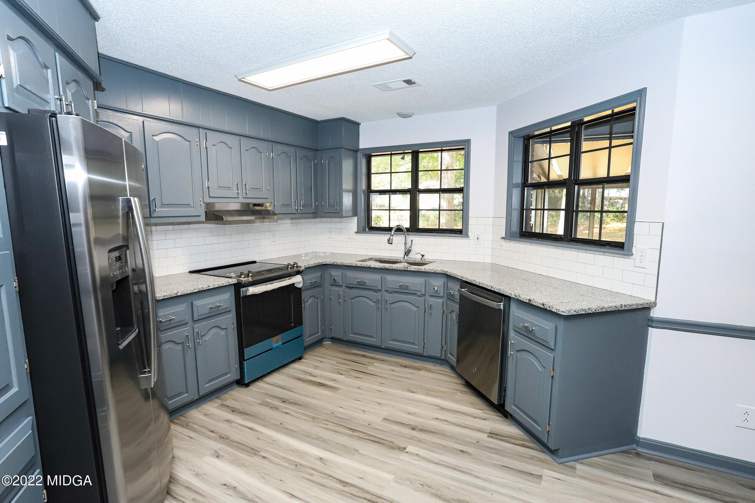 107 Ridge Circle Macon, GA 31216 - Photo 50 of 80 a kitchen with a sink cabinets and stainless steel appliances