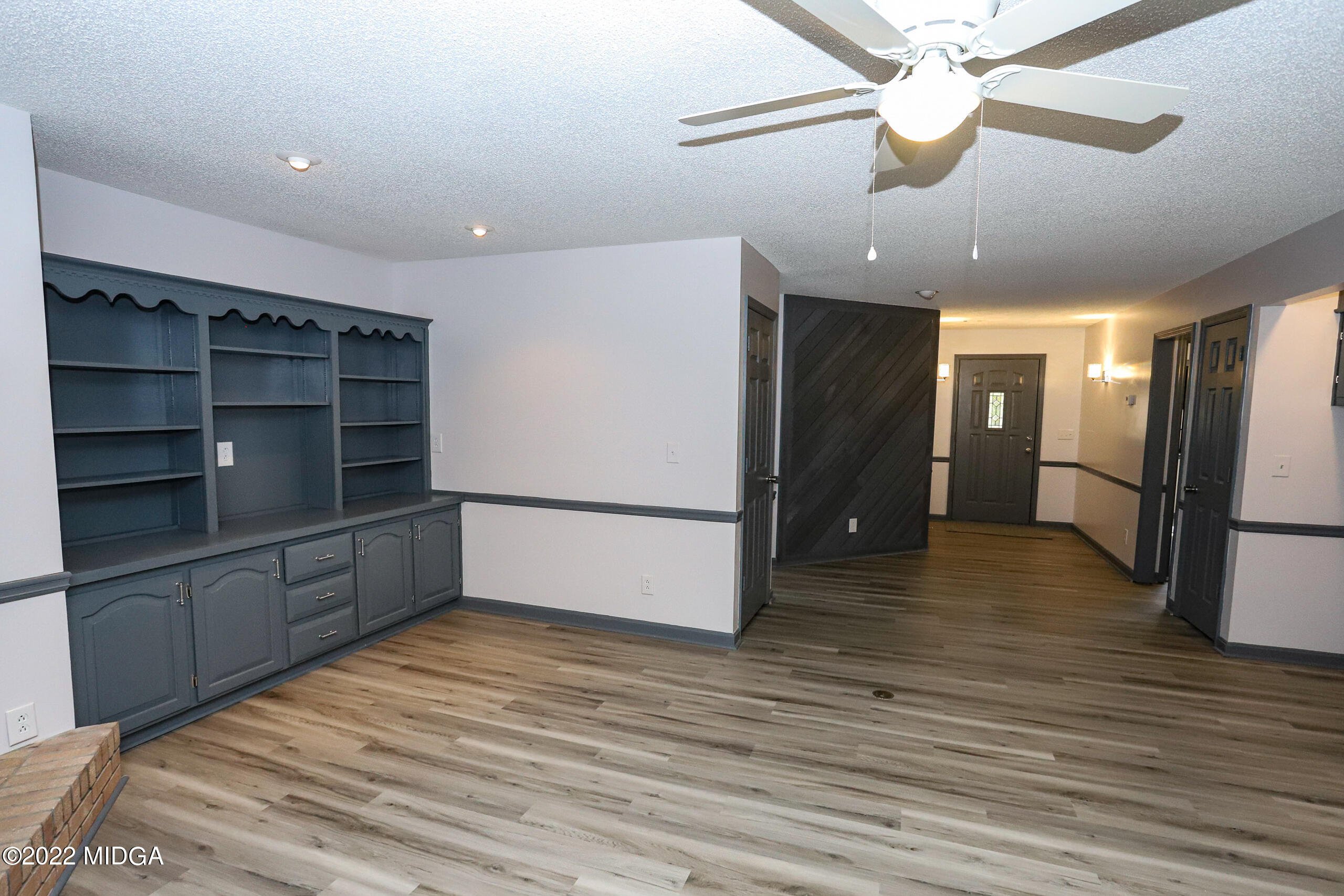 107 Ridge Circle Macon, GA 31216 - Photo 52 of 80 a view of a kitchen with a refrigerator and a ceiling fan