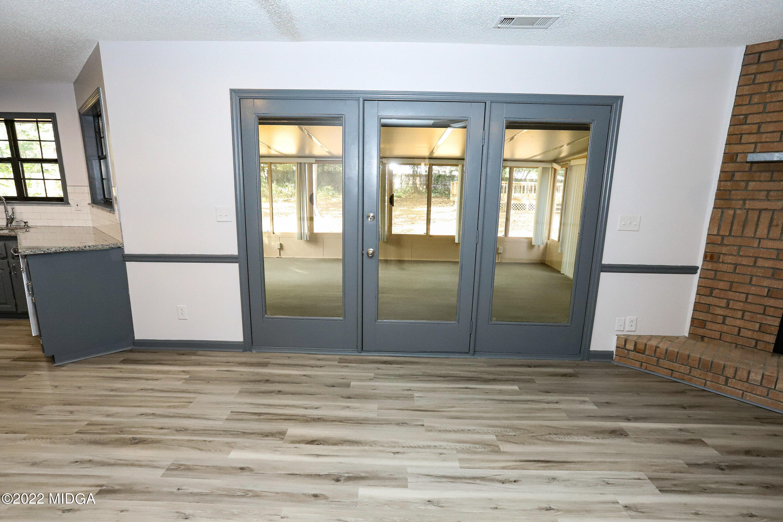 107 Ridge Circle Macon, GA 31216 - Photo 54 of 80 a view of an empty room with wooden floor and a window