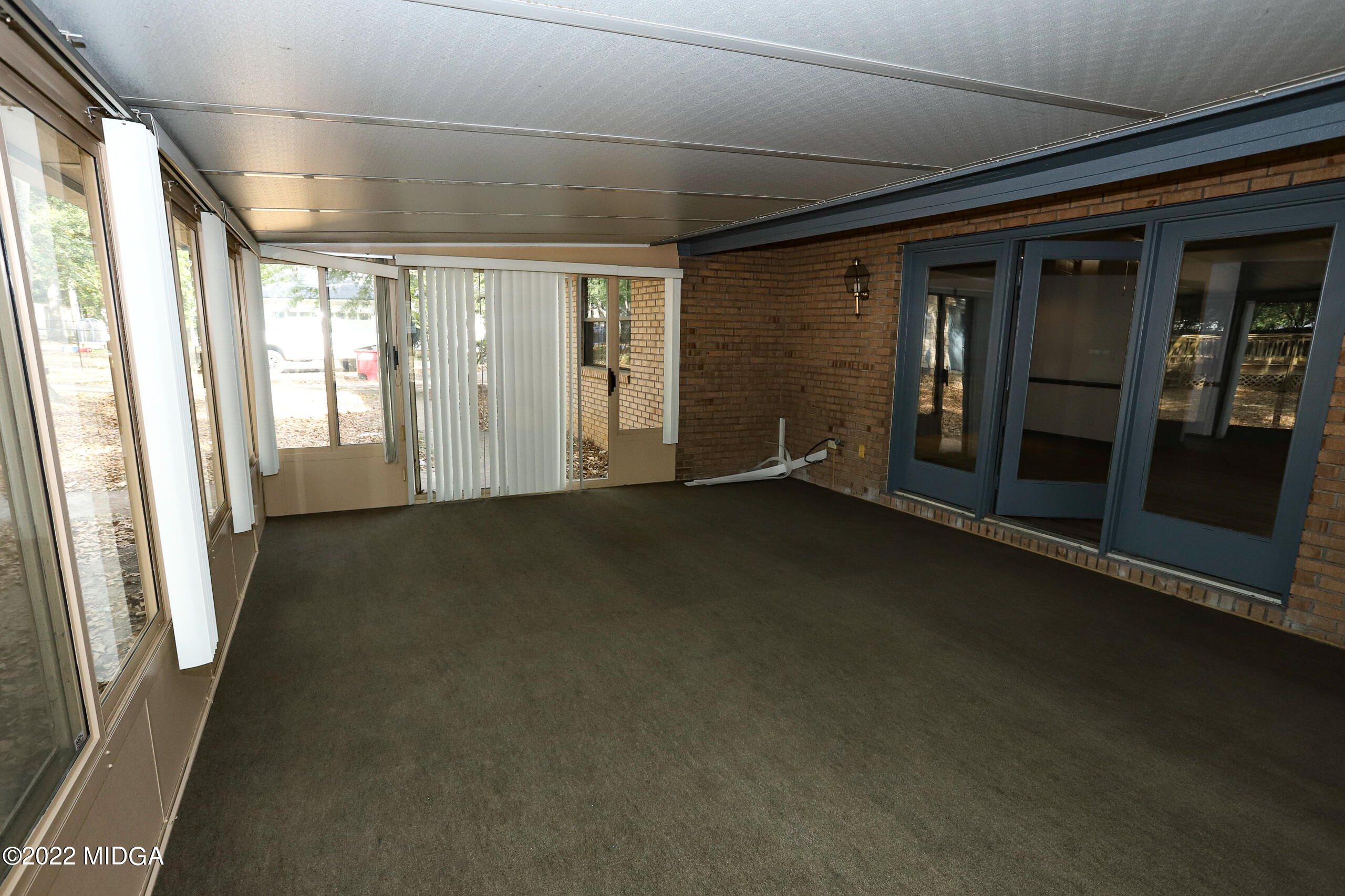 107 Ridge Circle Macon, GA 31216 - Photo 57 of 80 a view of empty room with floor to ceiling window