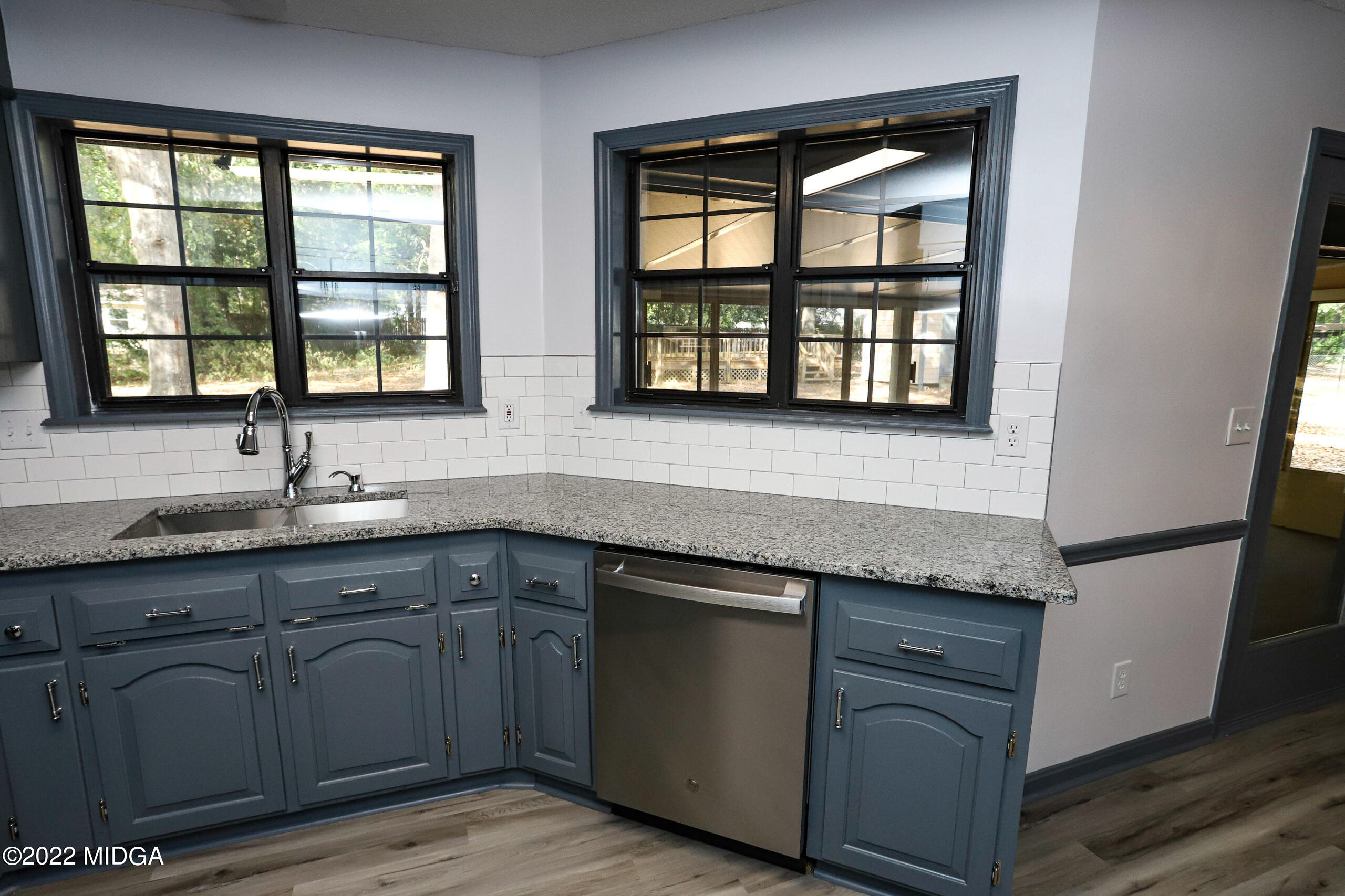 107 Ridge Circle Macon, GA 31216 - Photo 60 of 80 a kitchen with granite countertop a sink and a window