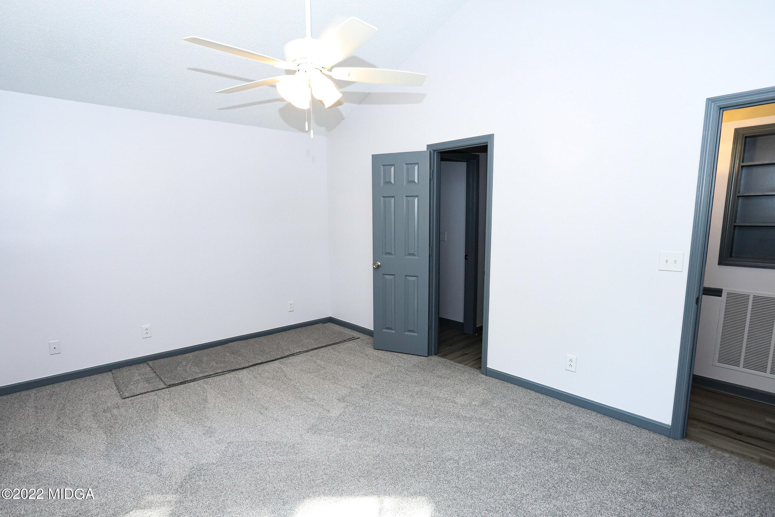 107 Ridge Circle Macon, GA 31216 - Photo 65 of 80 an empty room with windows and fan