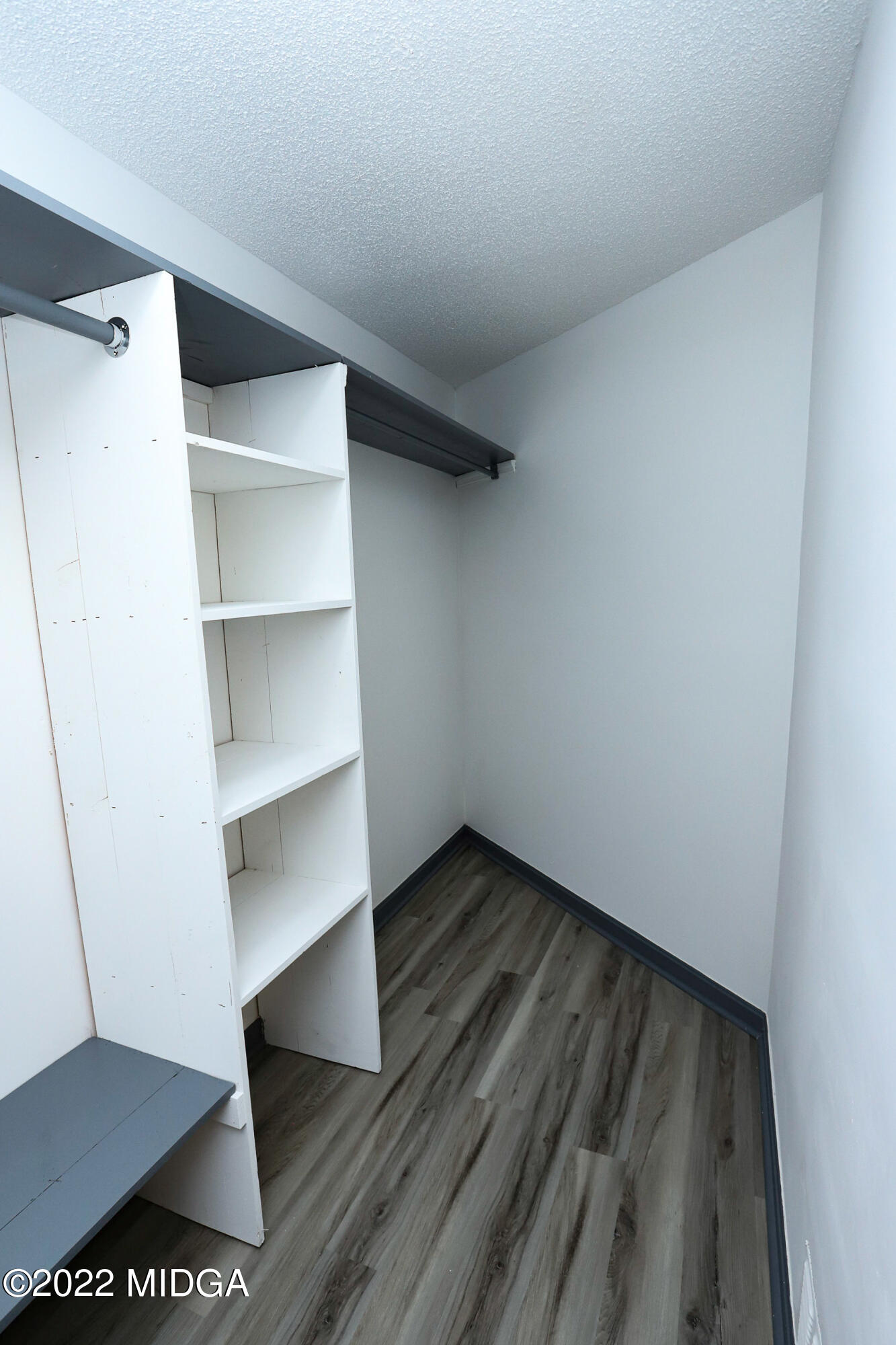 107 Ridge Circle Macon, GA 31216 - Photo 68 of 80 a view of walk in closet with empty racks