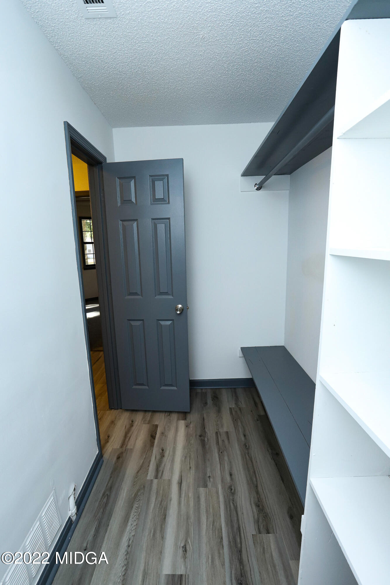 107 Ridge Circle Macon, GA 31216 - Photo 69 of 80 an empty room with wooden floor and closet