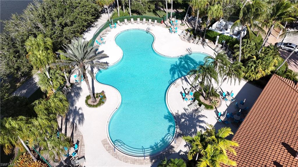 4910 Kingston Way Naples, FL 34119 - Photo 21 of 24 Community pool featuring a patio area