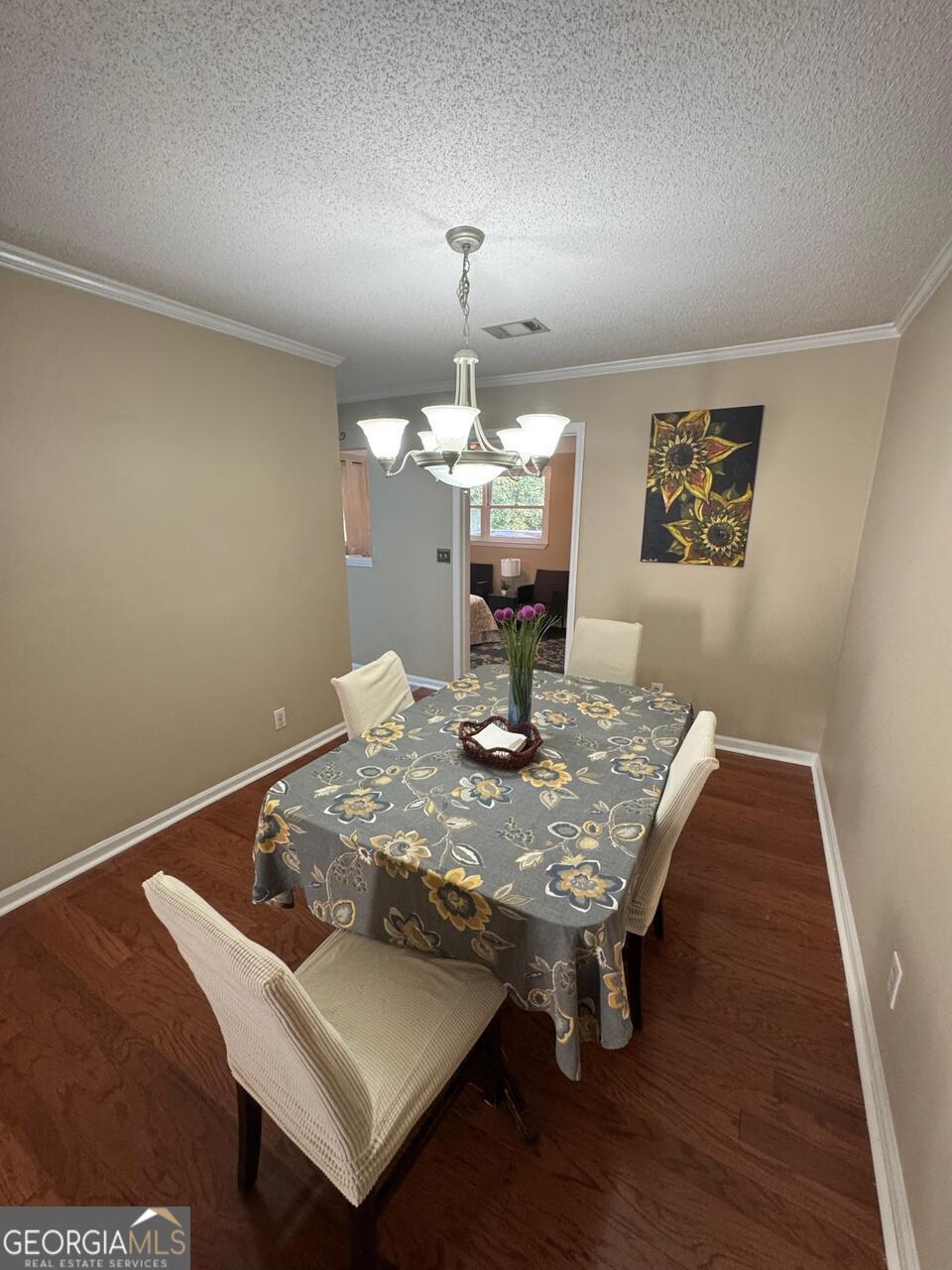 113 Manor Row Macon, GA 31210 - Photo 4 of 19 a view of a dining room with furniture and chandelier