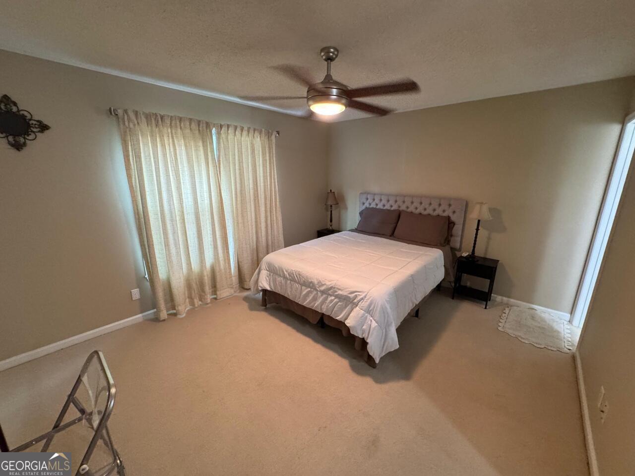 113 Manor Row Macon, GA 31210 - Photo 6 of 19 a bedroom with a bed and window