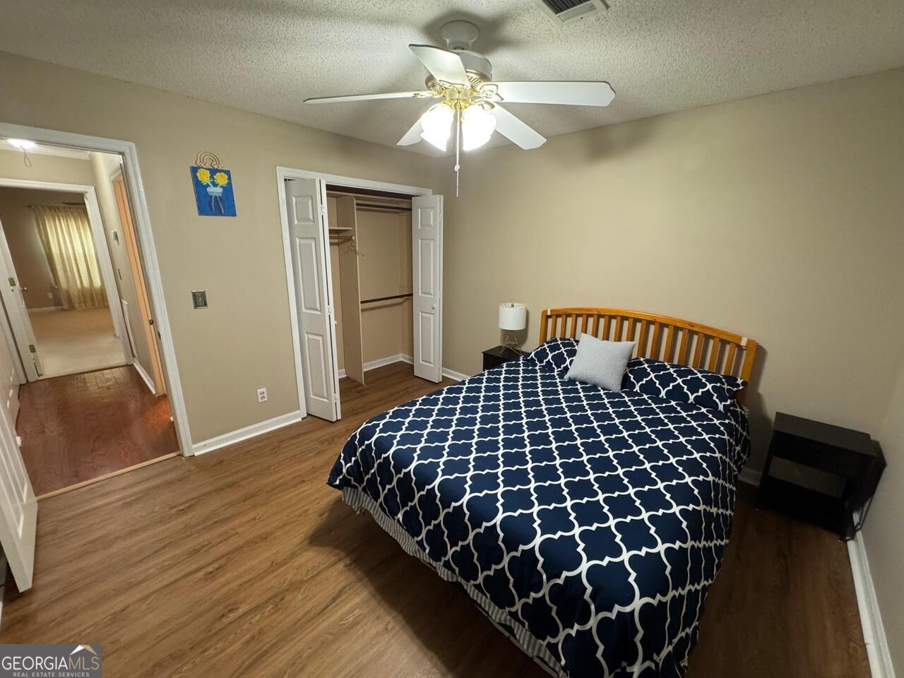 113 Manor Row Macon, GA 31210 - Photo 9 of 19 a bedroom with a bed and a walk in closet