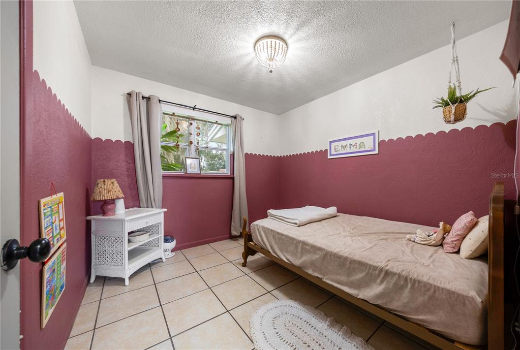 4023 Northeast 7th Street Ocala, FL 34470 - Photo 20 of 32 a bedroom with a bed and a window