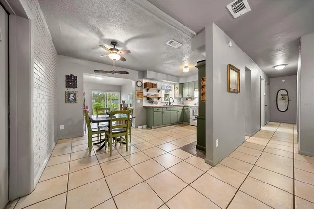 a view of a hallway with dining area