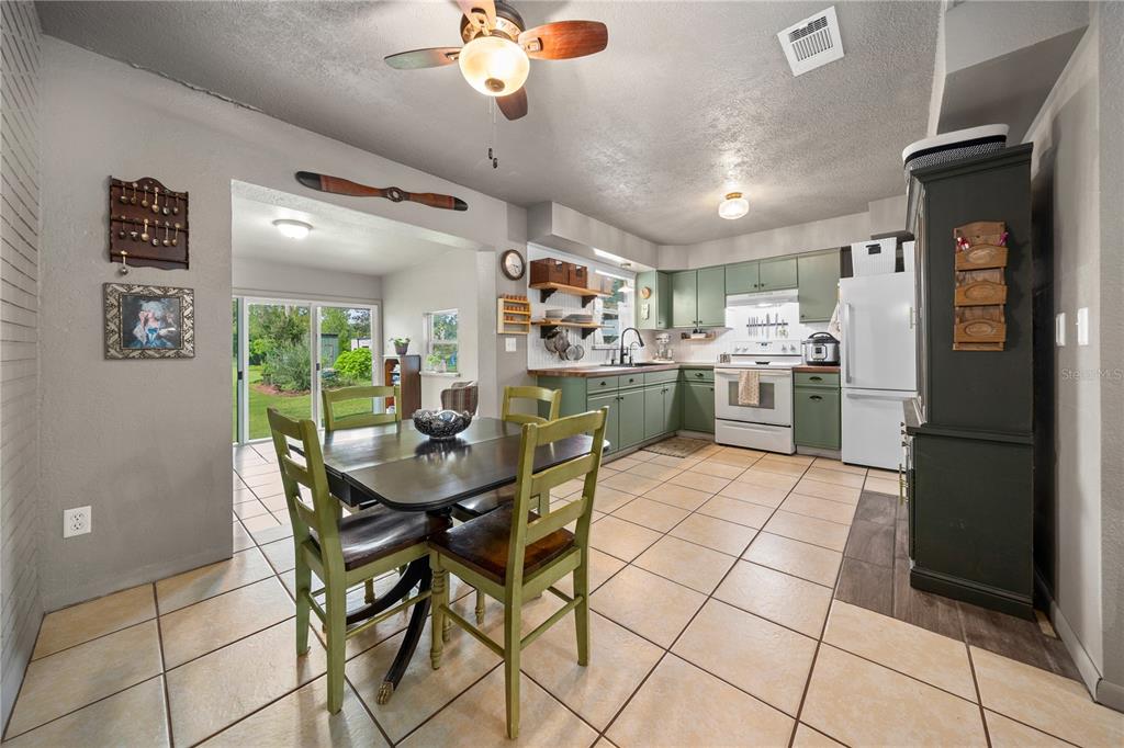 4023 Northeast 7th Street Ocala, FL 34470 - Photo 10 of 32 a view of a dining room with furniture