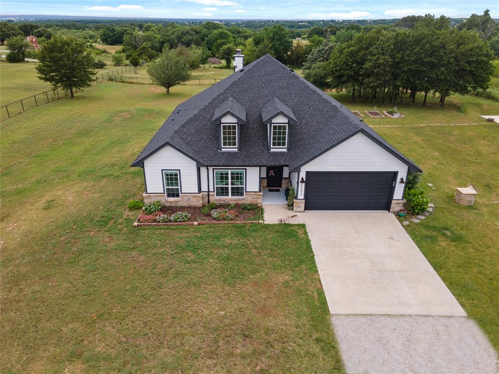 6093 Farm To Market Road 730 North Decatur, TX 76234 - Photo 2 of 28 a front view of a house with garden