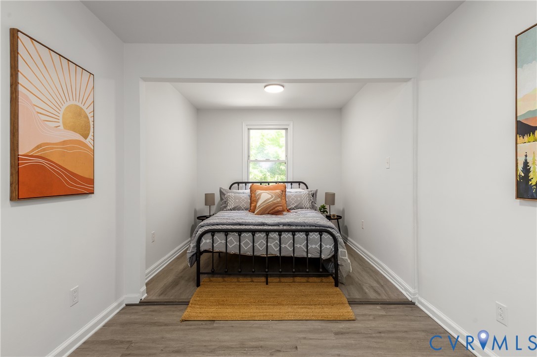3406 Meadowbridge Road Richmond, VA 23222 - Photo 25 of 41 a view of bedroom with furniture and wooden floor
